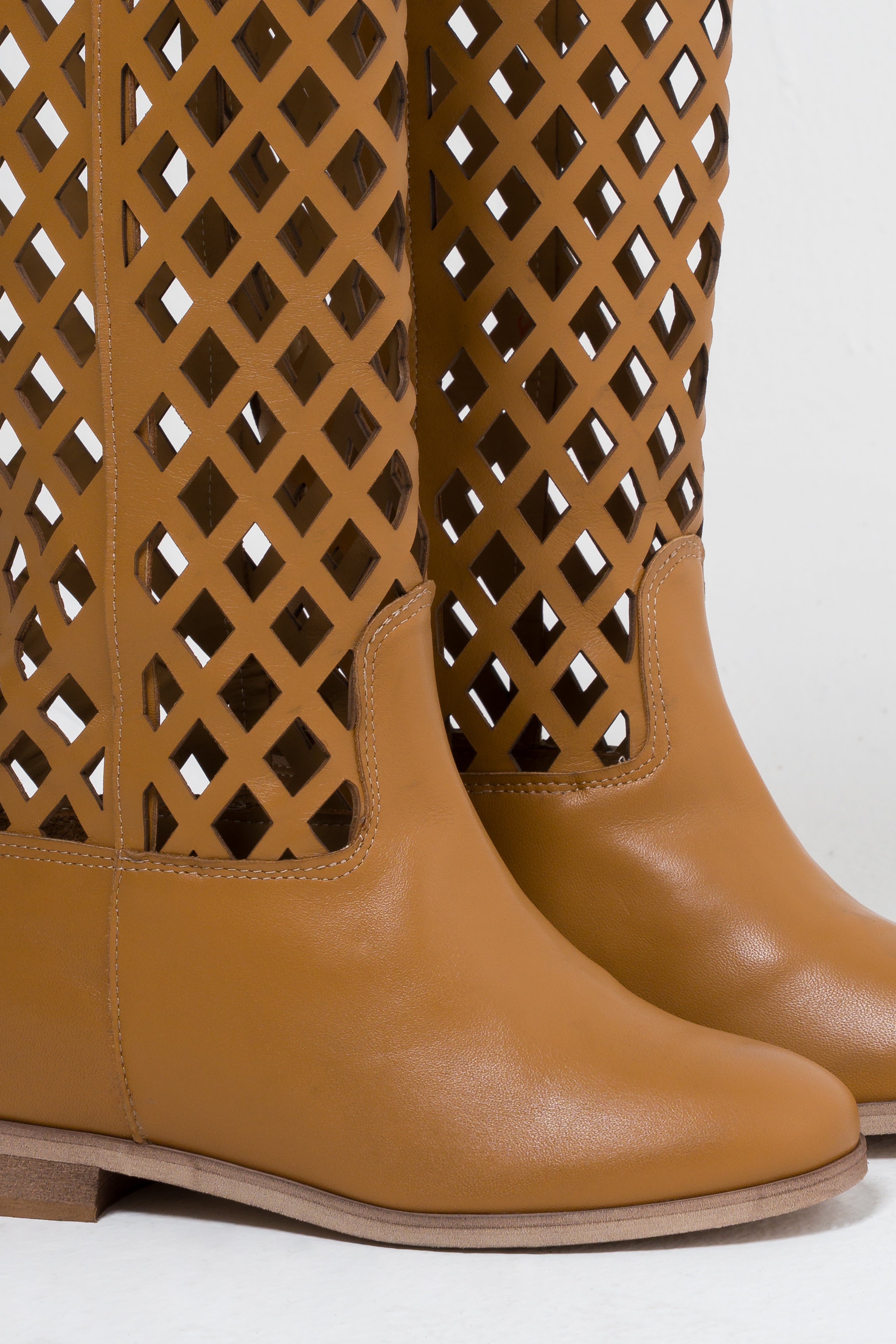 R120_NET - Tubular boot in Perforated Black Genuine Leather with golden accessory and internal rise