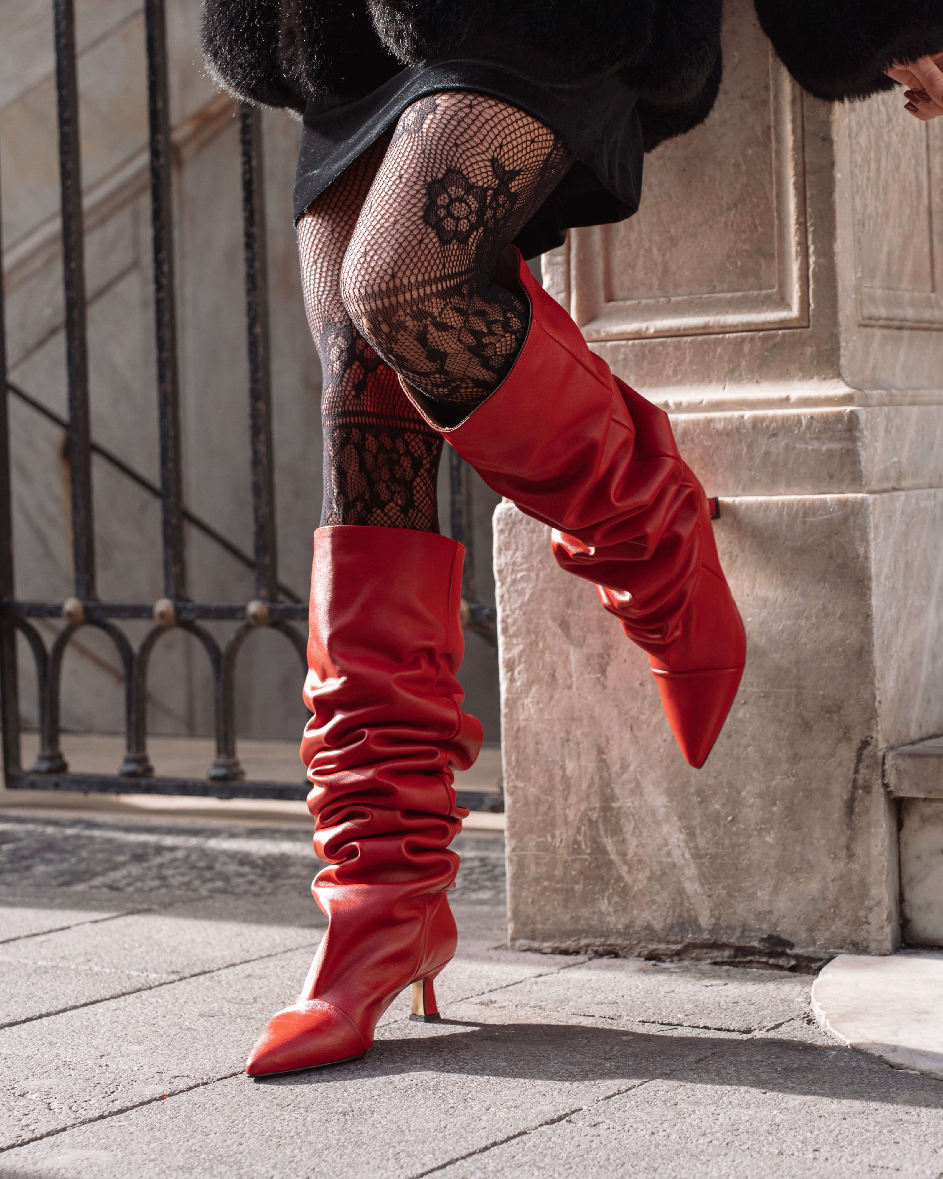 JENNIFER - High knee tubular boot in real red leather with draped effect. 5 cm heel.