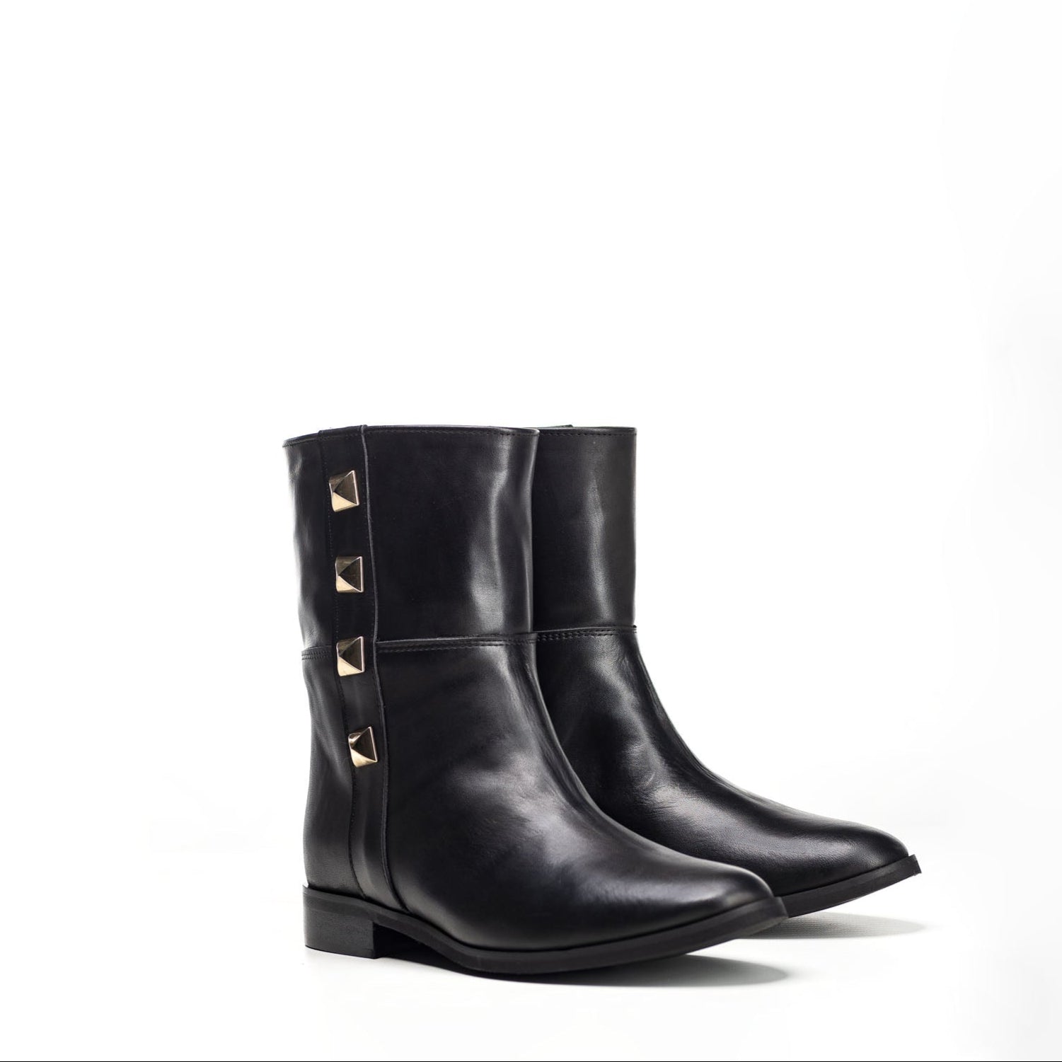 1132 - Tubular ankle boot in genuine leather with golden pyramid buttons
