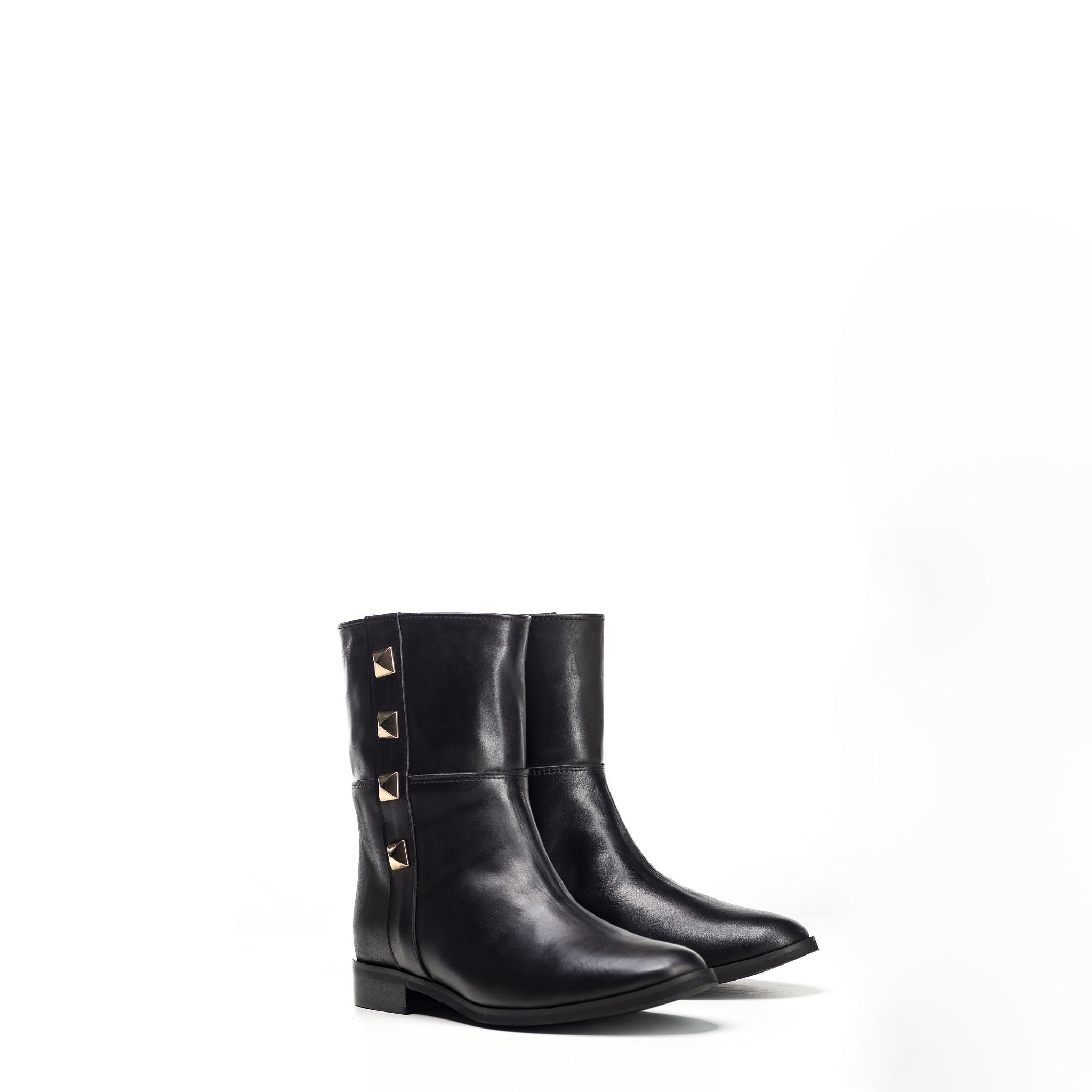 1132 - Tubular ankle boot in genuine leather with golden pyramid buttons