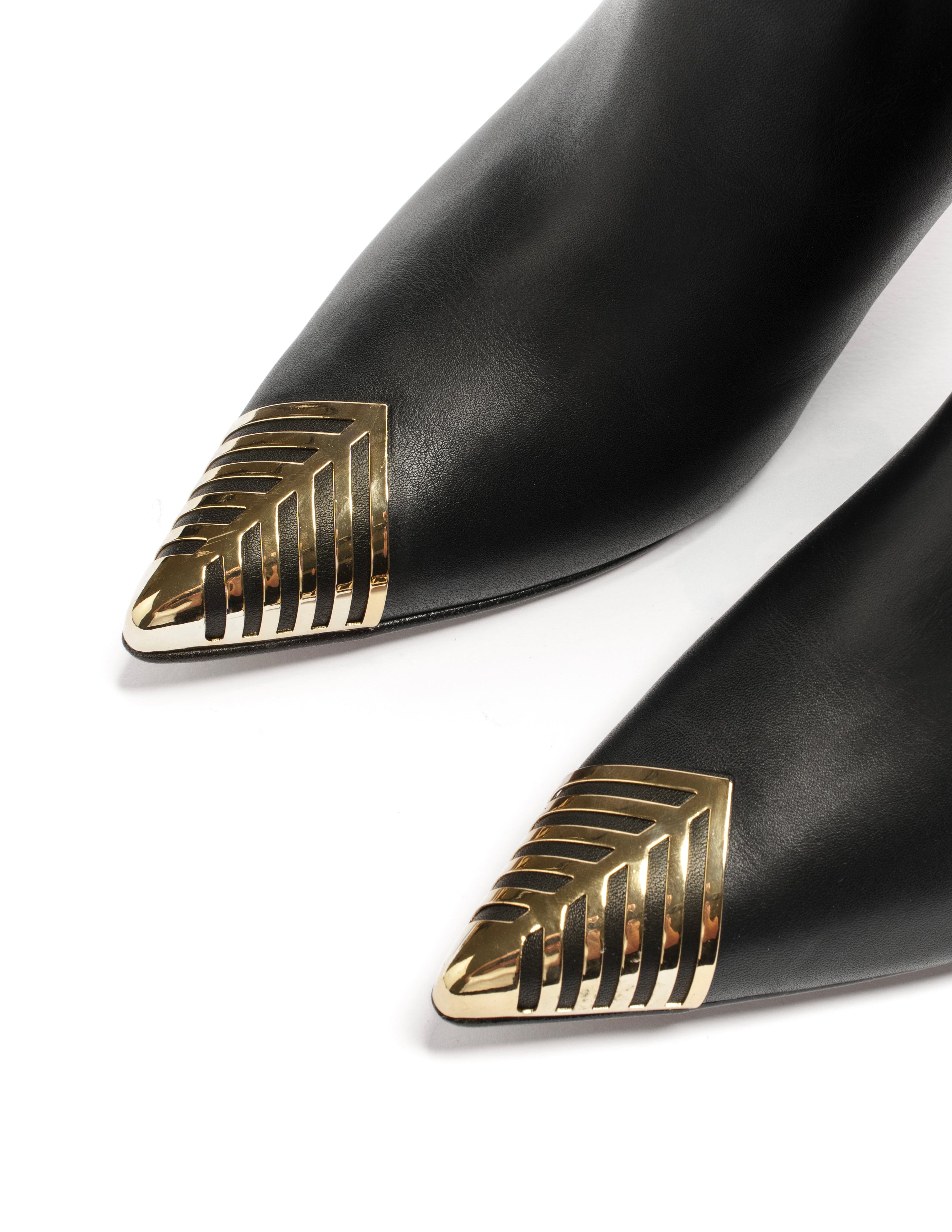 OBLIQUE - Tubular boot in genuine leather with asymmetric cut and gold plaque